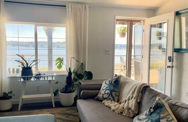 Waterfront bungalow with 2-bed house and studio connected via spacious deck.