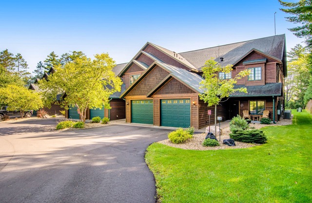 Waterfront condo with lake views, boat slip, grill, beach, AC, fireplace, & WiFi