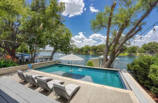 Waterfront getaway! Pool, lake views and unforgettable memories.