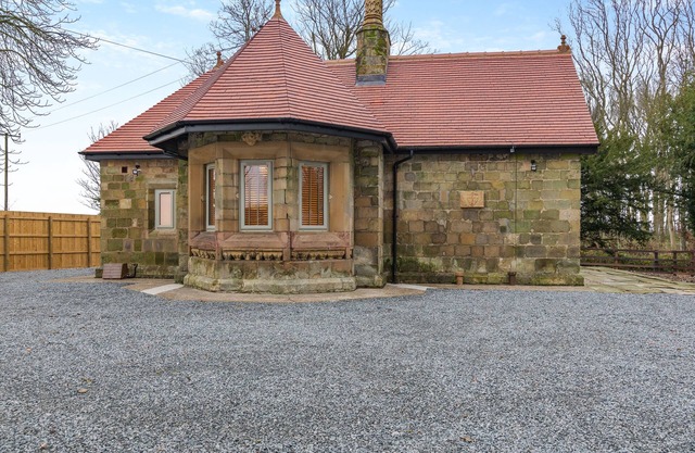 We love this historic lodge with large garden and wood fired hot tub.