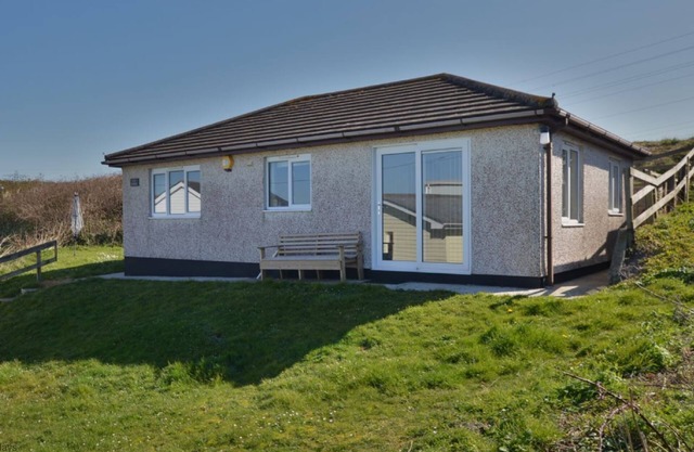 Winray is set in a quiet spot on a grassy bank, accessible via several stone steps