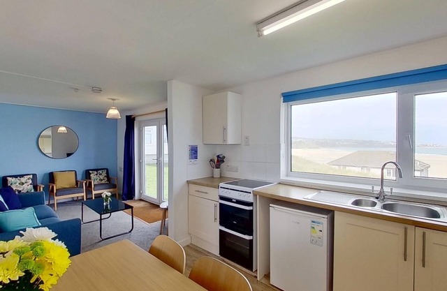 With a bright ocean facing living room and double doors which take in the views towards St. Ives bay