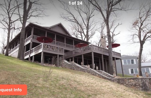 Wonderful wood lodge with 200’ lakefront. Dock Well appointed and stocked.