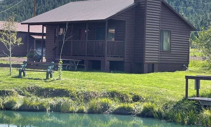 Greer Cabin | 2 BR-1BA Log Cabin on Main Street. Stocked trout pond, fireplace, porch, Dogs Ok