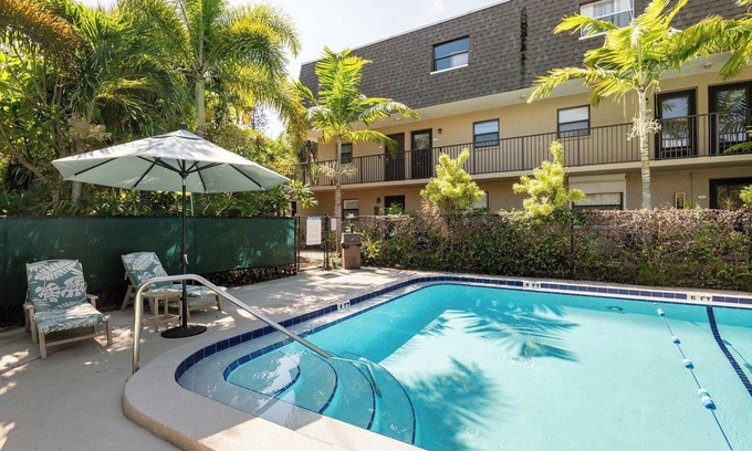 Indian Harbour Beach Condo | 2BR Stylish Retreat with BBQ, Pool & Beach