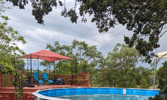 Cedar Creek House | 3 Secluded Country Homes on 15 Acres. Pool, Ping Pong, Hot Tub, Patio, Pond and BBQ. Close to COTA.