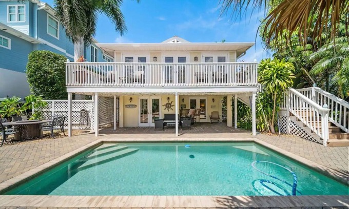 Gulf Harbor House | 3BED 3BATH Tropical Paradise WATERFRONT POOL HOUSE On Canal 1 mile to the BEACH!