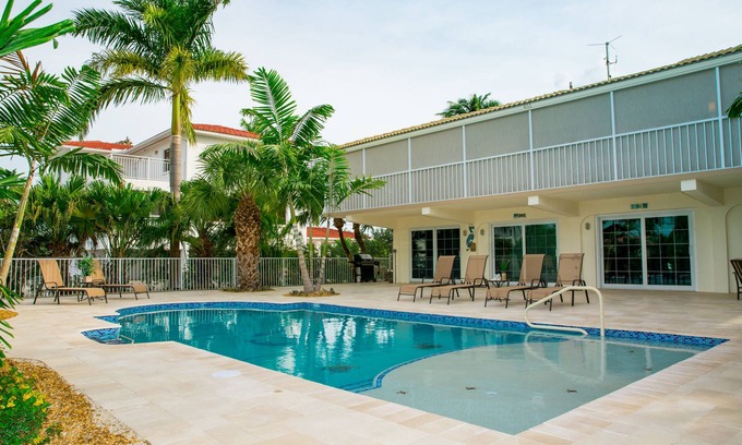 Key Colony Beach House | 4 bedroom/3 bathroom on Canal w/HEATED POOL and New Outdoor kitchen w/Bar Area