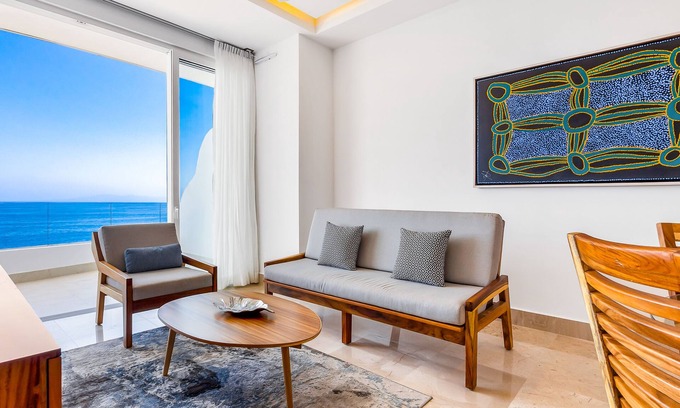 Mismaloya Condo | 4th-floor oceanfront condo with balcony, outdoor pool, ocean views & AC