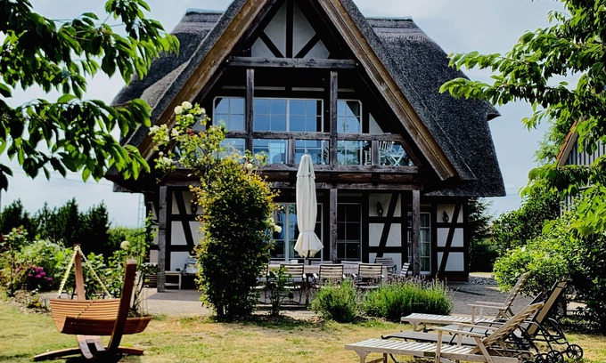 Mellenthin House | 5 star frame house with thatched roof und view at the water on the island Usedom