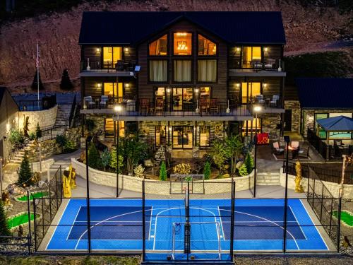 Gatlinburg - Pigeon Forge House | Alpine Splash - Luxury - Private indoor pool, theatergaming, large yard, Pond, Basketball court!