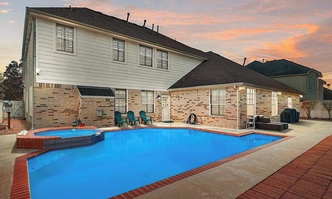Champion Forest House | AMHOT - in Houston with heated pool spa