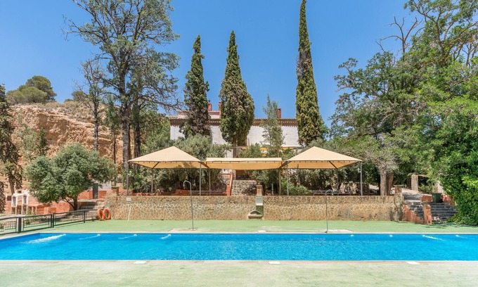 Guadix Apartment | Apartment 'Cueva Karmen' with Mountain View, Shared Pool and Wi-Fi