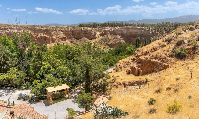 Guadix Apartment | Apartment 'Cueva Luna' with Mountain View, Shared Pool and Wi-Fi