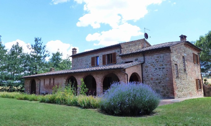 Torrita di Siena Apartment | Apartment with private covered terrace in front of the garden