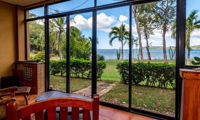 Playa Flamingo Condo | Beachfront Condo with Warm, Rustic Interiors & Direct Access to Playa Flamingo