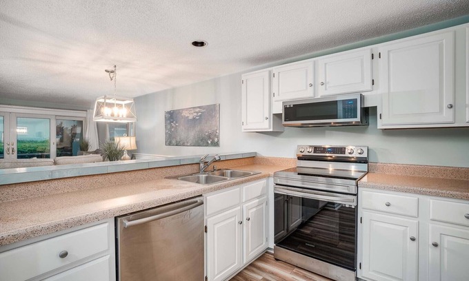 Pine Knoll Shores Condo | Beachwalk 115 - Pine Knoll Shores Oceanfront Condo! Steps to beach. Sleeps 8!