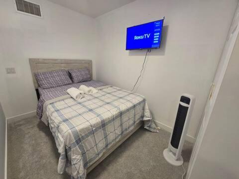 West Edmonton House | Bedroom with TV in Upland E