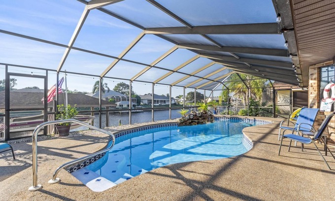 Palm Harbor House | Blue Haven Large Waterfront Pool Home | Boat Dock | Canal | Water Views | Pool Bar | WIFI | Fishing