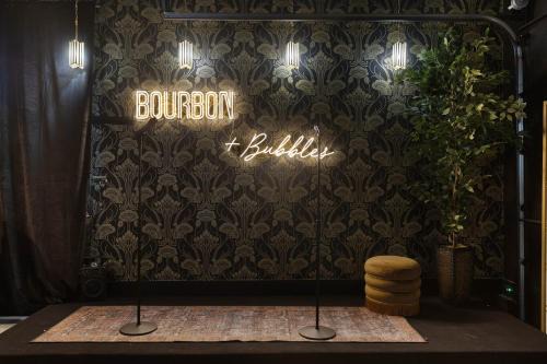 Katie Hill Neighborhood House | Bourbon & Bubbles - Rooftop Hot Tub & Speakeasy