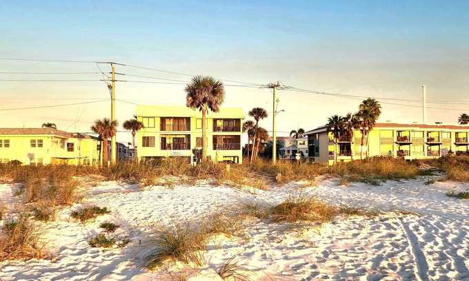 Bradenton Beach Condo | Bright, corner unit, with open floor plan and views from nearly every room!