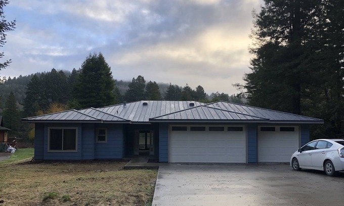 Crescent City House | Bright, open concept, family friendly house, private sandy beach on the river