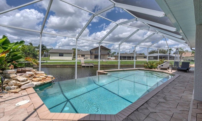 Fort Myers House | Cape Coral 3-Bedroom Canalfront Pool Vacation Home with Dock