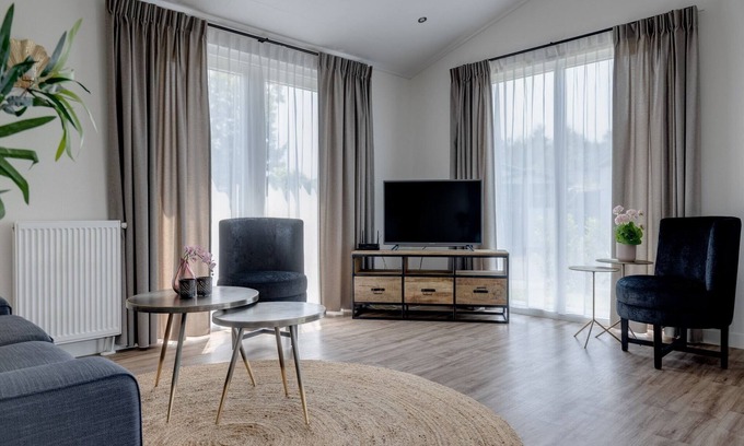 Municipality of Veldhoven Ski Chalet | Chalet by Pond in Eindhoven Holiday Park