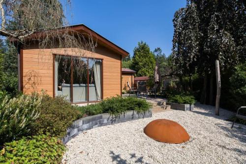 Krachtighuizen Ski Chalet | Chalet omringd door groen op de Veluwe