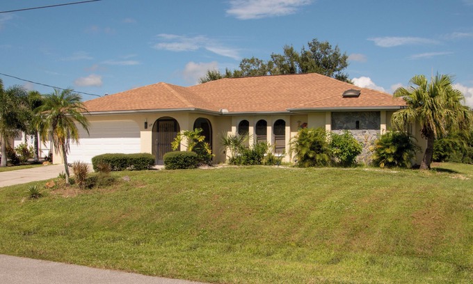 Port Charlotte House | Charming 3-bedroom house in Port Charlotte on canal with dock and private pool.