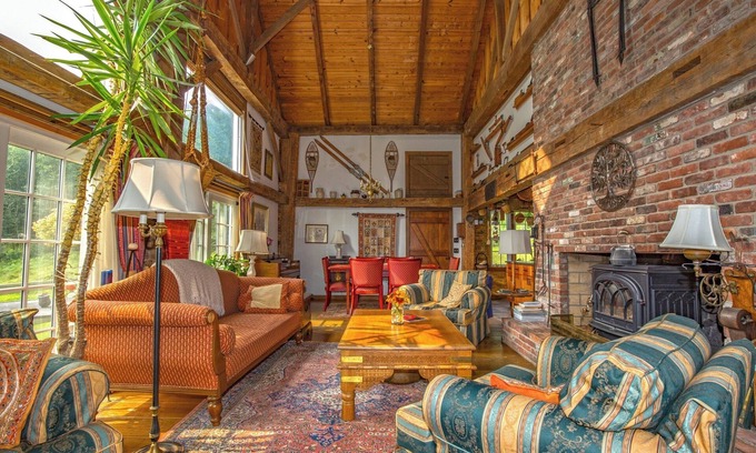 Williamstown House | Charming barn ski house with exposed rustic beams and cathedral ceilings.