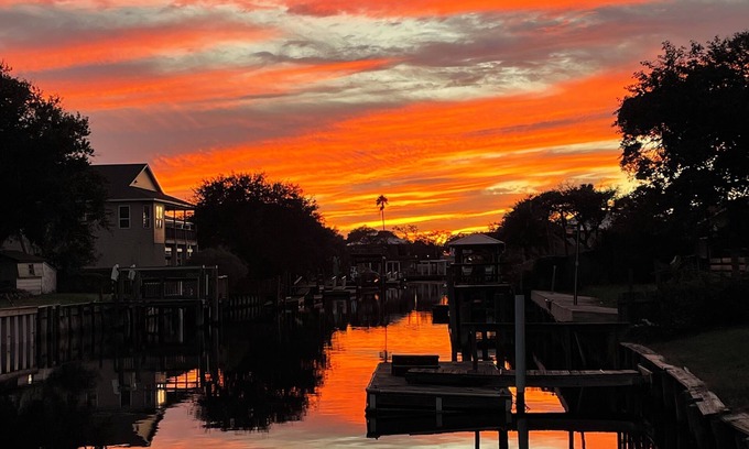 Butler Beach House | Charming Canal Front Cottage! Walk to the Beach!