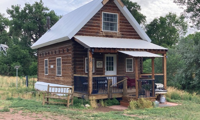 Canon City Cabin | Charming Creekside Cabin next to 4 Mile Creek with mountain views. Dog friendly!