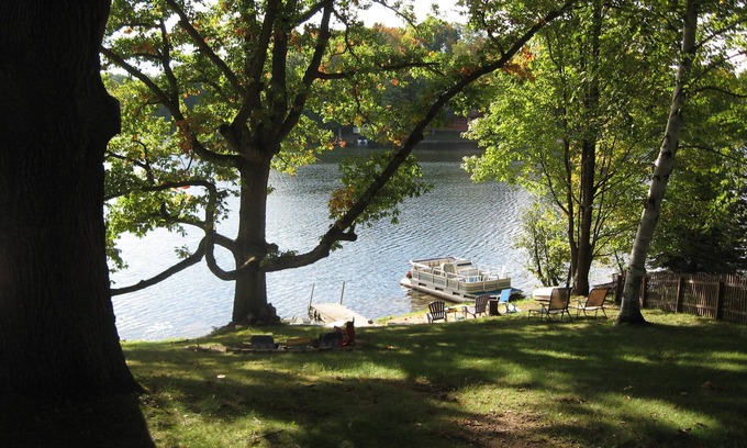 Evart Cottage | Charming Lakefront Cottage, Private Sandy Beach, Excellent Fishing
