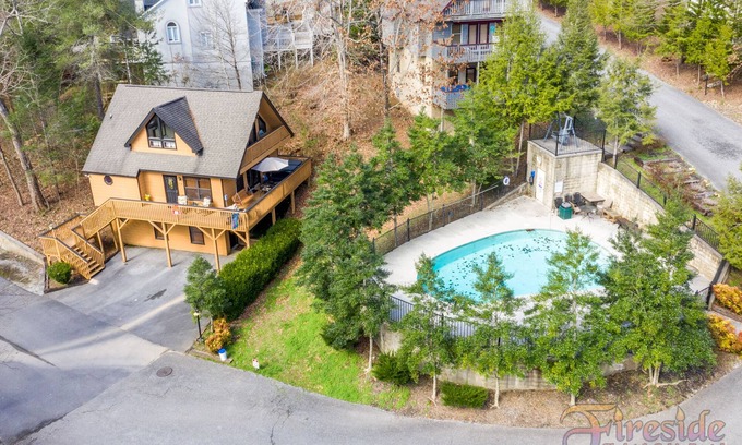 Gatlinburg - Pigeon Forge Ski Chalet | Close to Pigeon Forge outdoor pool access view the pool from the deck sleeps 5