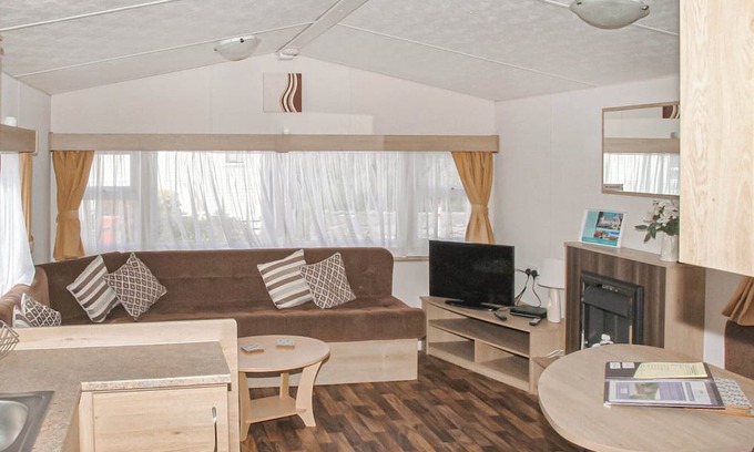 Gwespyr House | Comfortable 12ft-wide caravan with one double and one twin.