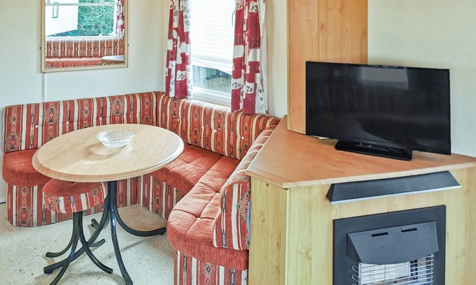 Fishguard House | Comfortable caravan with one double and two twin.