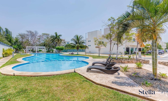 Puerto Juarez Apartment | Comfortable Family Retreat: Pool, BBQ & Playground