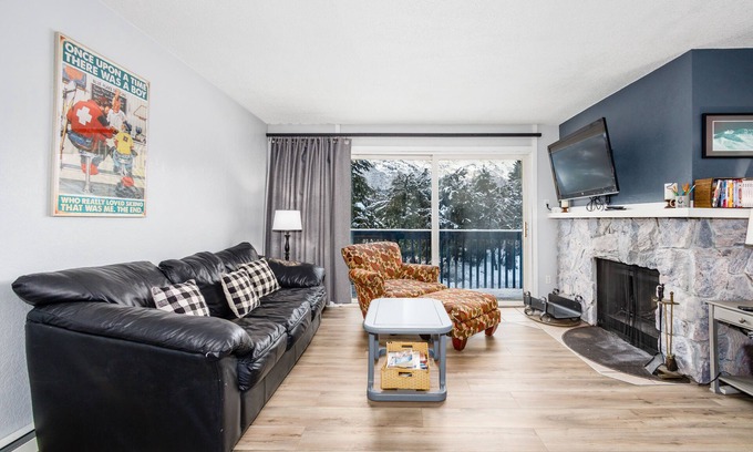 Alyeska Condo | Condo with lanai, mountain view, fireplace, & spiral staircase