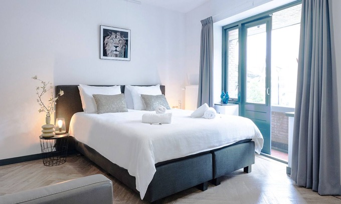 Tilburg Apartment | Contemporary studio featuring a private kitchen, bathroom, and two balconies