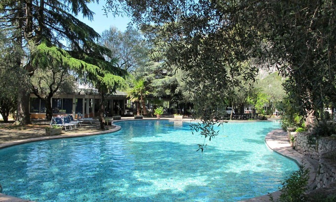 Corno Apartment | Cosy apartment for 4 guests with A/C, WIFI, pool, TV, patio and parking
