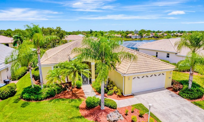 Herons Glen House | Country club retreat with private pool, water views, on-site golf, & gym