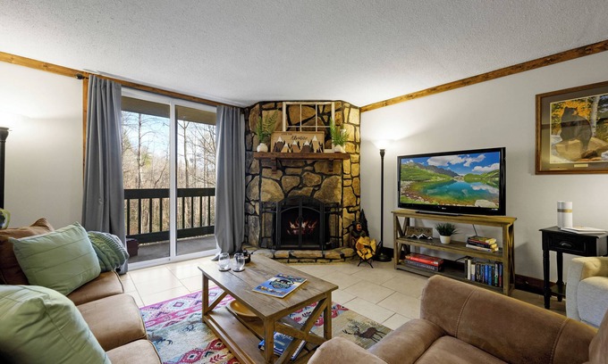 Chalet Village Condo | Cozy Condo with Wood-burning FP & Patio Gliders