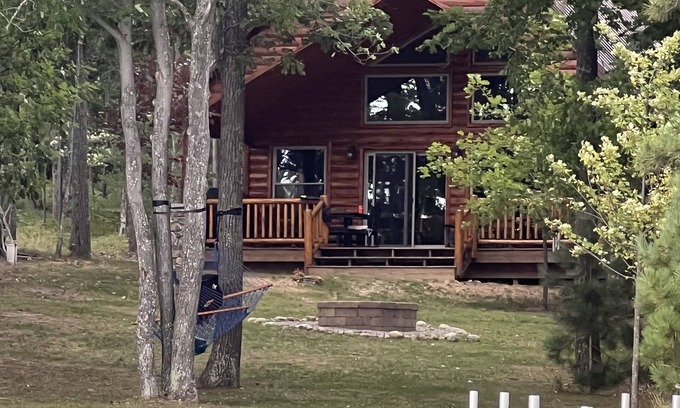 Hillman Cabin | Cozy lake-front home on crystal clear, all sports Long Lake in Hillman, MI.