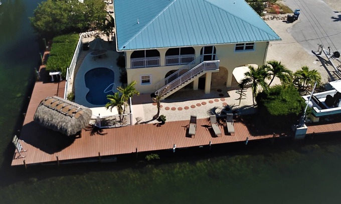 Little Torch Key House | Deep Water Corner Canal Lot with Heated Pool, Tiki Hut & 240' Dock