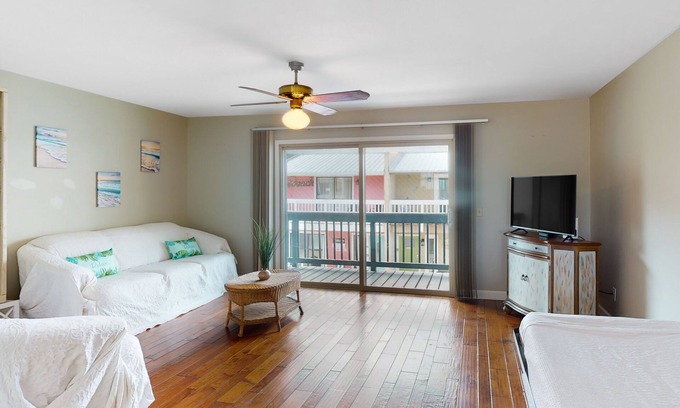 Holiday Beach House | Dog-friendly condo with pool, balcony, beach access, central AC, & W/D