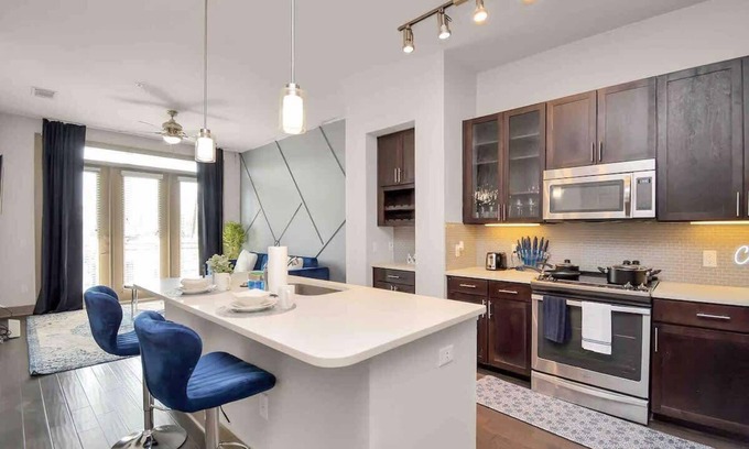 Central Business District Apartment | Downtown Elegance:Upscale Houston Retreat King Bed