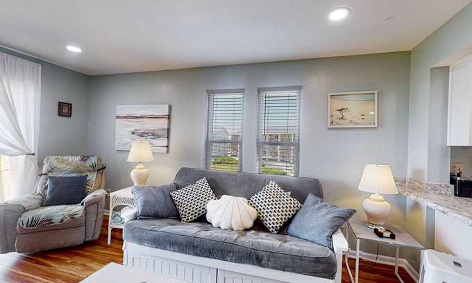 Surf City Condo | Dreamy beach condo with pool, easy beach access & furnished balcony with views