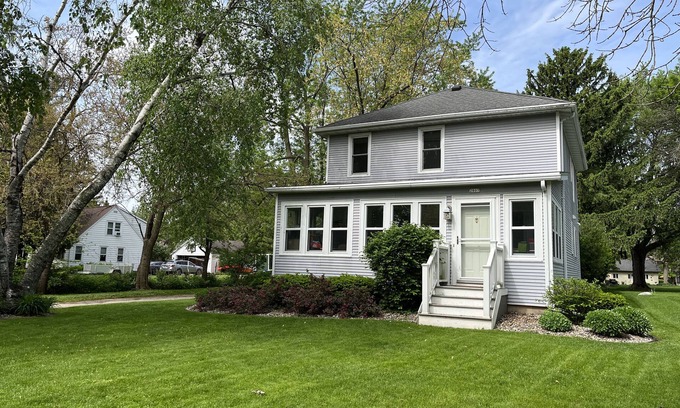 Oshkosh House | EAA rental near airport w/firepit, backyard, peekaboo lake view, and a clear sky