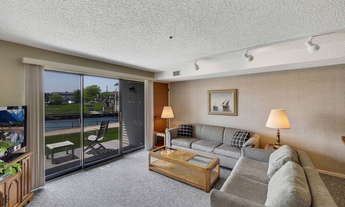 Charlevoix Condo | Edgewater #119 | Water Views + Private Balcony | Pool, Hot Tub, Sauna | Patio